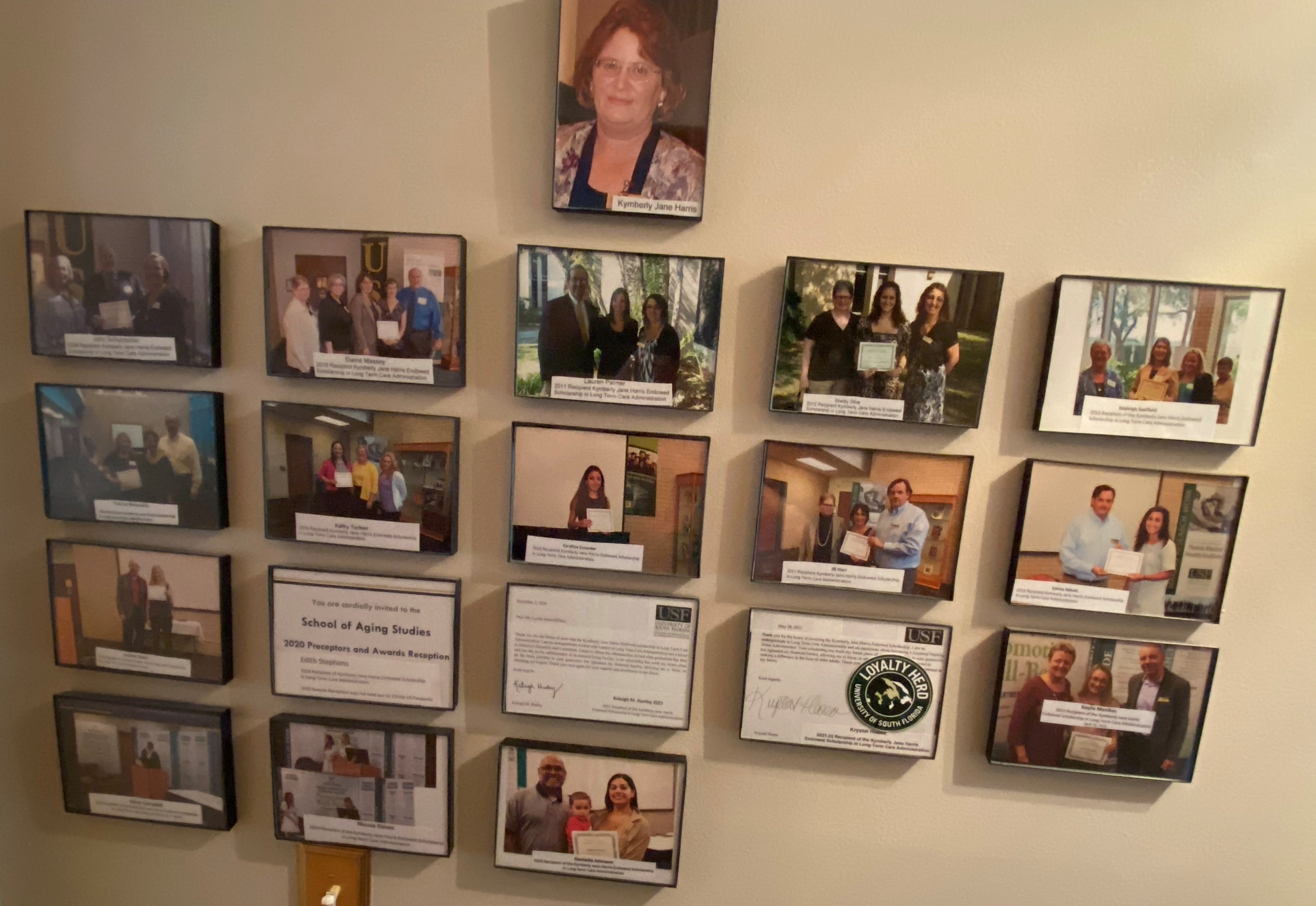 photo frames on wall depicting scholarship recipients and Kym