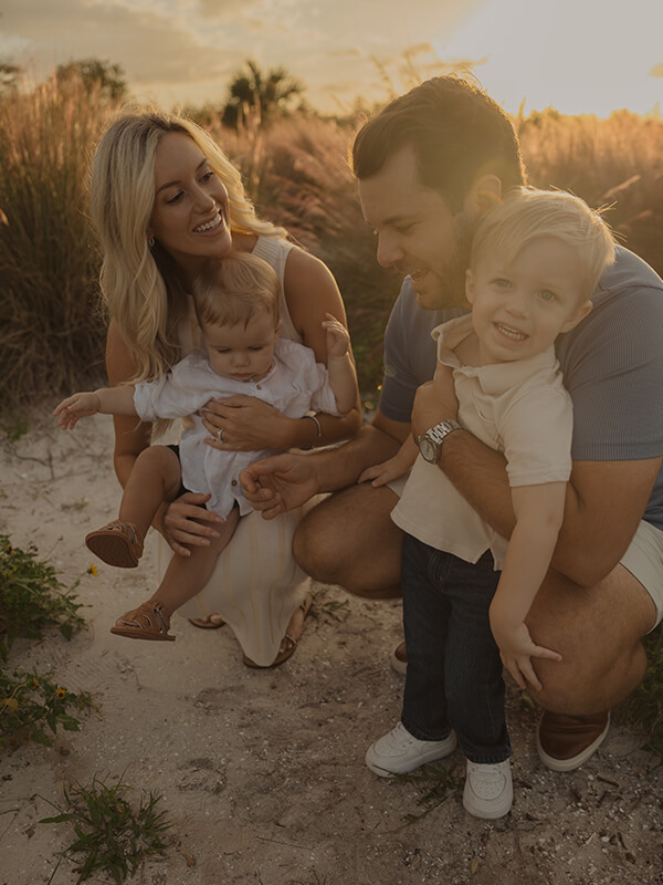 Anja and Dillon hold their two sons, Crew and Charlie