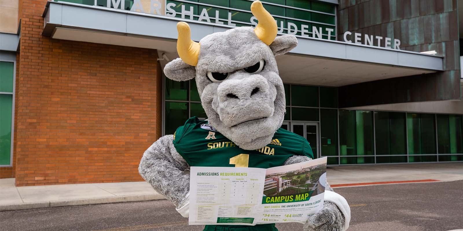 Rocky with a campus map