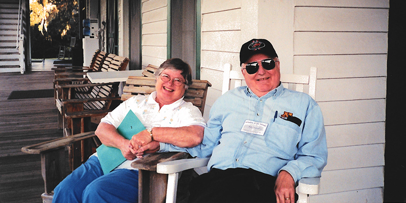 Bob and his wife sitting on their porch.