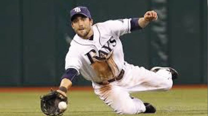 Sam with Rays catching ball.JPG