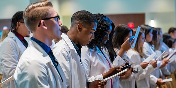 Graduates recite the Nursing Oath